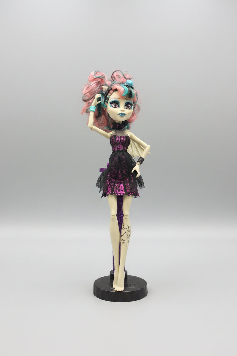 Monster High doll with colorful hair and outfit on a black background