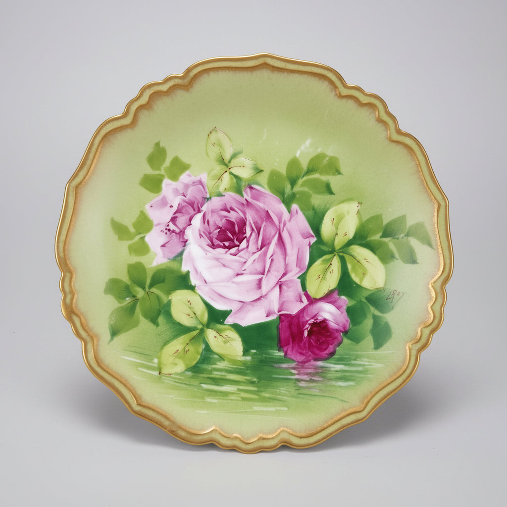 Decorative plate with pink roses on a green background