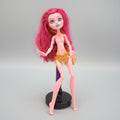 Toy figure with pink hair and colorful outfit on a black background