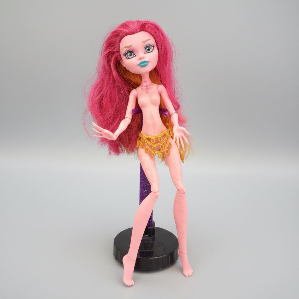 Toy figure with pink hair and colorful outfit on a black background