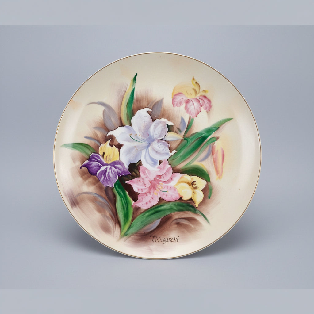 Decorative plate with floral design on a black background