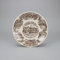 Decorative plate with illustrations of landmarks and text on a dark background