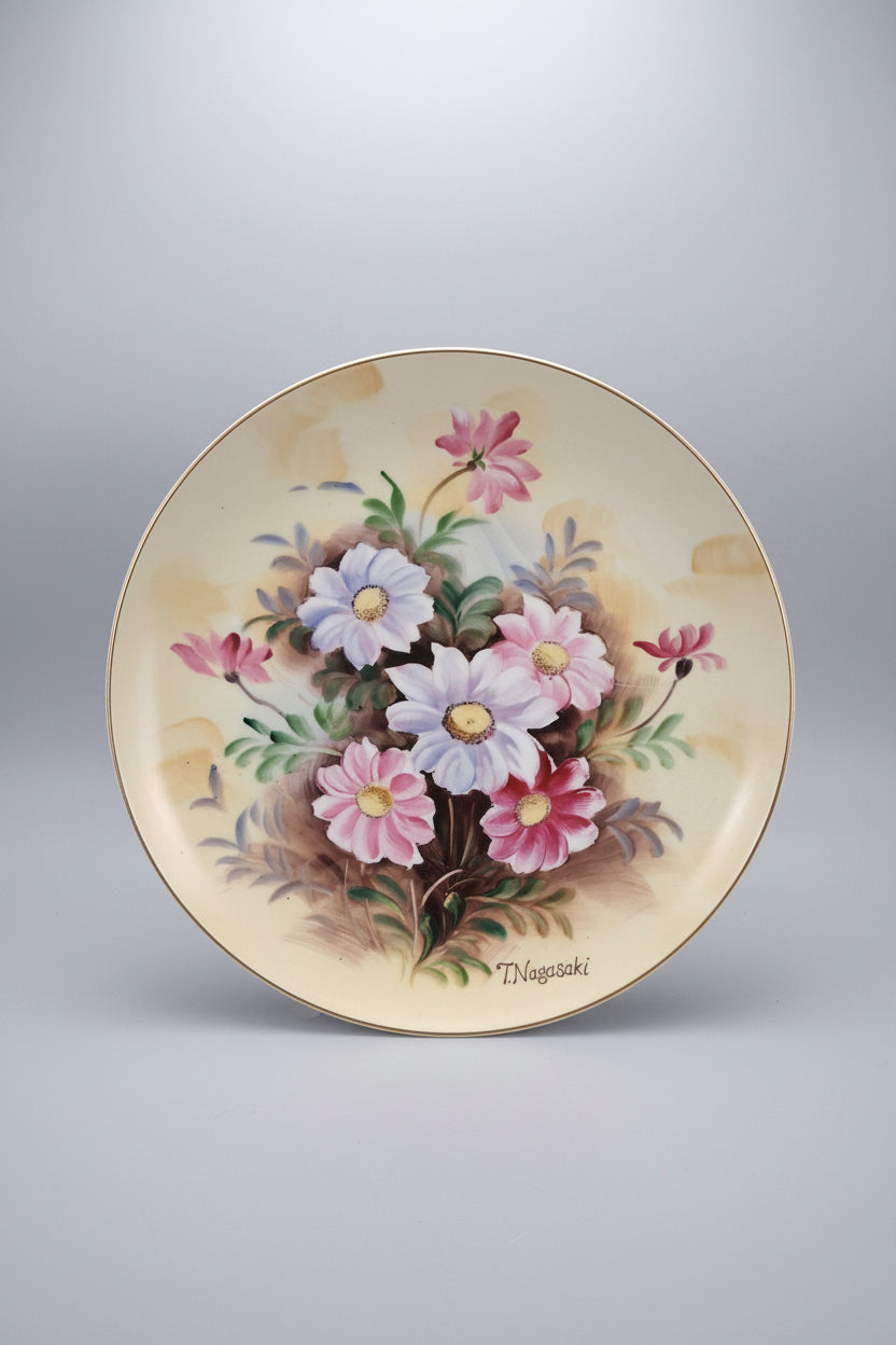 Decorative plate with floral design on a black background