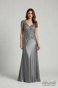 Silver evening gown on a hanger with boxes in the background