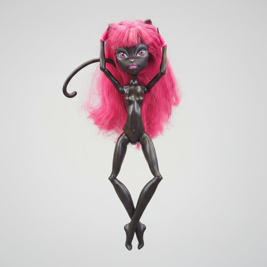 Toy figure with pink hair and a purple sword on a black background