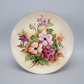 Decorative plate with floral design on a black background