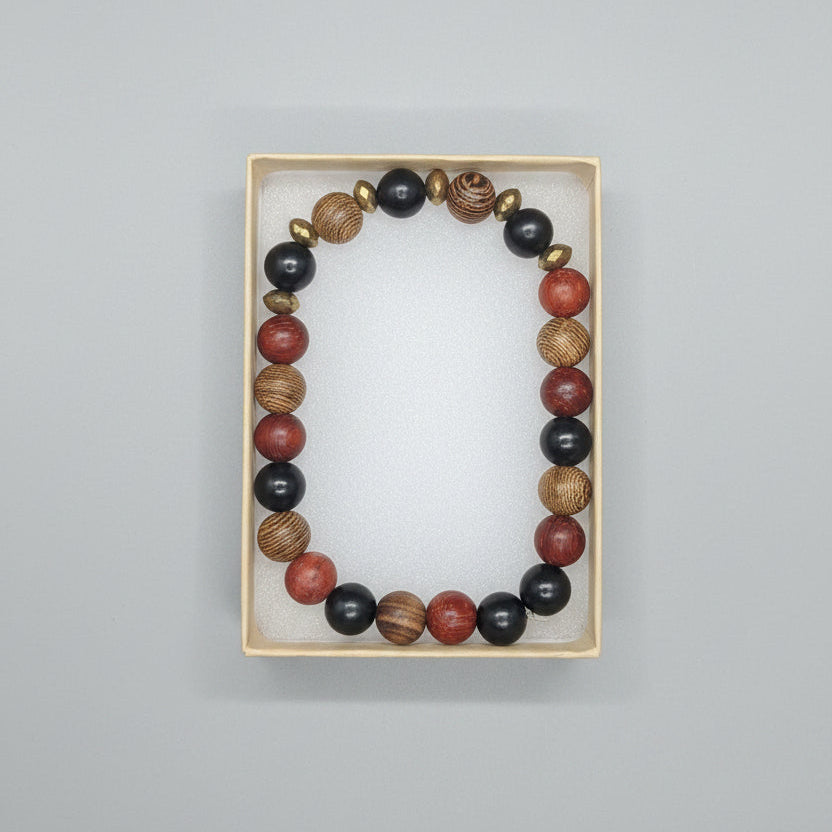 Beaded bracelet on a display card with other jewelry items in the background.