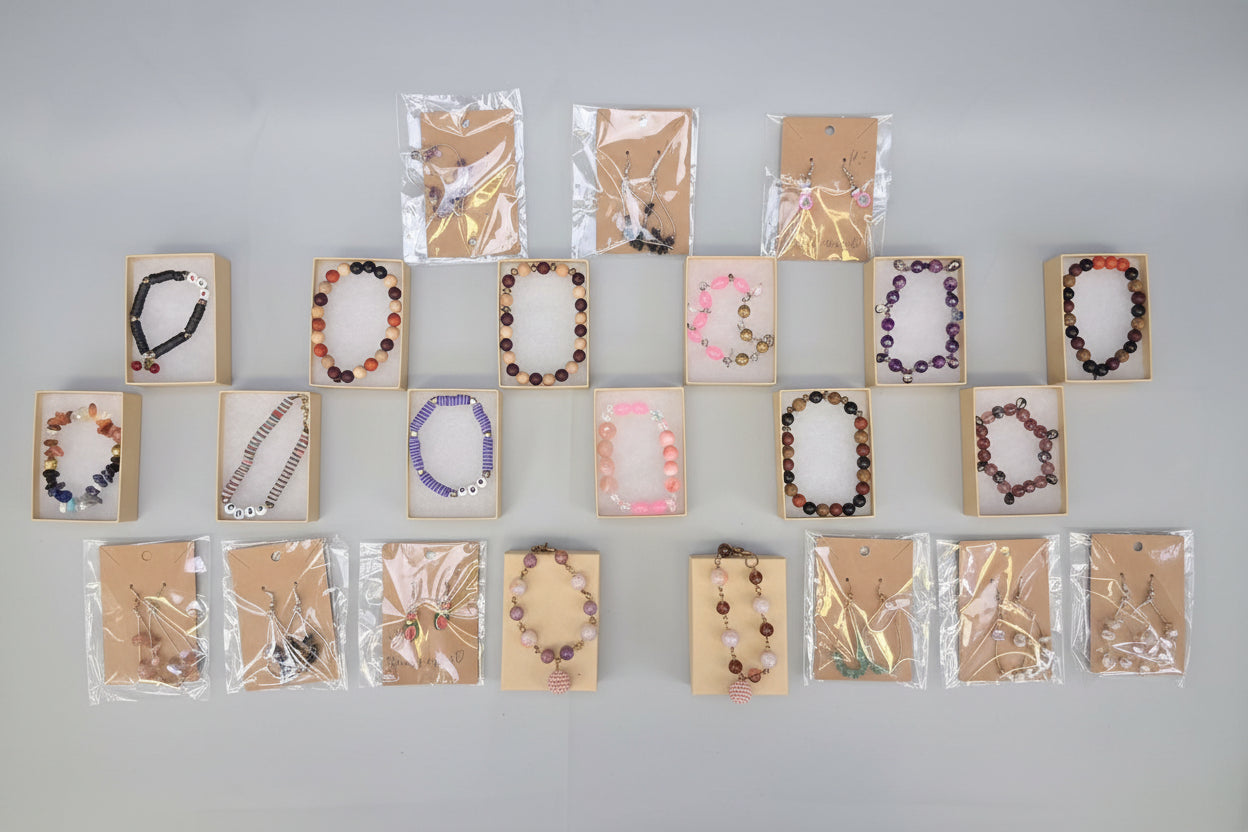 Collection of beaded necklaces on display against a dark background