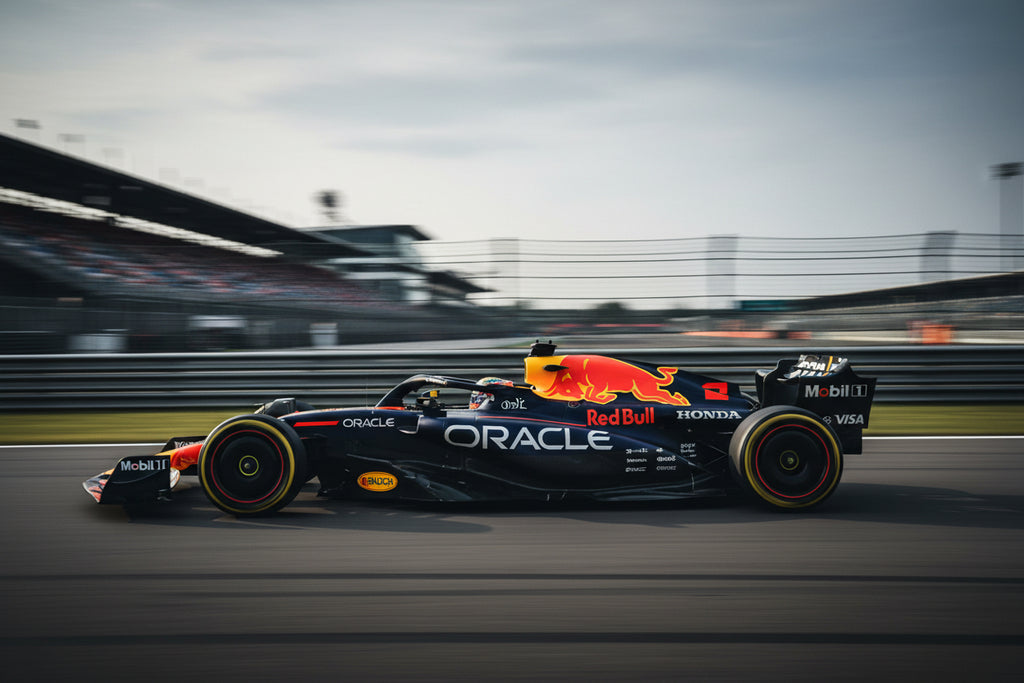 Model Formula 1 car on a track with visible branding