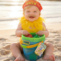 Colorful toy storage bucket with a tag on a black background