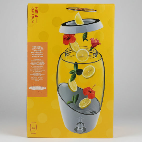 Mortier Pièon 5L electric lemonade maker in its original yellow packaging box, featuring an illustration of lemon slices, hibiscus flowers, and mint leaves inside the glass pitcher.
