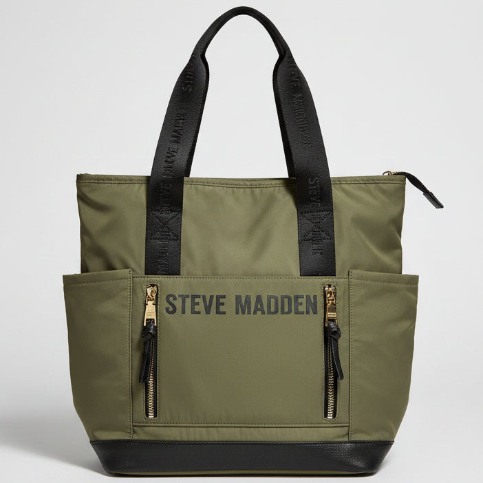 An olive green Steve Madden tote bag with black handles, a black bottom panel, and 'STEVE MADDEN' printed in black across the front pocket, shown on a white background.